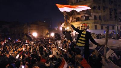Egyptians celebrate in Tahrir Square after hearing the news of the resignation of president Hosni Mubarak on February 11, 2011. John Moore / Getty Images