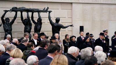 People gather at the Armed Forces Memorial at the National Memorial Arboretum in Alrewas, Staffordshire. PA