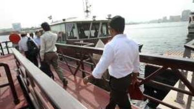Passengers board a water bus at Baniyas station on Dubai Creek yesterday.