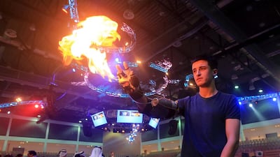 Xavier Goby, grade 12 student from Deira International School, Dubai and the Inkover flame thrower to visitor at the Innovator 2014 Exhibition in FGB arena at Zayed Sports city in Abu Dhabi. Ravindranath K / The National