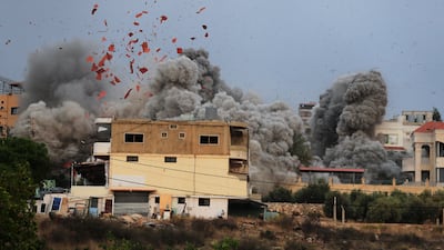 Smoke rises after an Israeli air strike in the village of Tayr Debba, southern Lebanon. AP