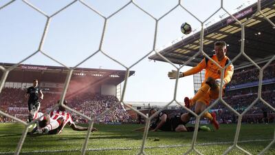 Liverpool's Simon Mignolet saves a shot from Stoke City's Saido Berahino. Liverpool beat Stoke 2-1 on Saturday. Carl Recine / Reuters