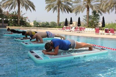 Doing core exercises while balancing on water is a great way to get fit while still having fun. Courtesy Float DXB