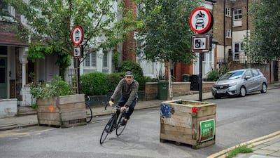 A cyclist passes through a low-traffic neighbourhood barrier. Prime Minister Rishi Sunak has called for a review of LTNs in England but three weeks on nothing has been done. Getty Images