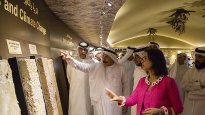 Prof Abdulrahman Alsharhan, ICBA chairman, centre, and Dr Ismahan Elouafi, ICBA director general, at the opening of the Emirates Soil Museum in Dubai on Thursday. Duncan Chard for The National