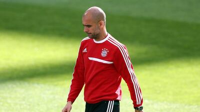 Head coach Pep Guardiola gestures during their FC Bayern Muenchen training at the Santiago Bernabeu Stadium ahead of the UEFA Champions League semi-final first leg match against Real Madridon April 22, 2014 in Madrid, Spain. Martin Rose/Bongarts/Getty Images