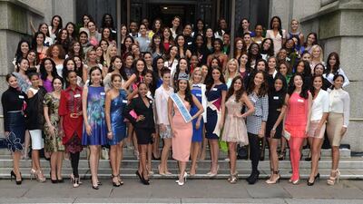 Miss World 2013, Megan Young and other contestants attend a photocall for Miss World 2014. Anthony Harvey / Getty Images