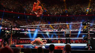 Seth 'Freakin' Rollins goes for a top rope move on to Riddle.