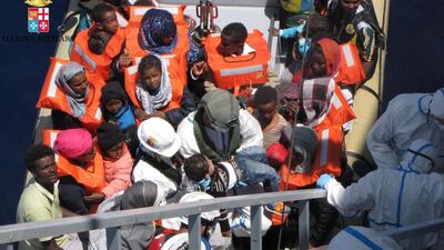 African migrants are rescued by the Italian navy from a ship in the Mediterranean. Marina Miltare / AFP Photo