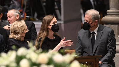 Former secretary of state Hillary Clinton and her daughter, Chelsea Clinton, speak to former vice president Al Gore. AFP