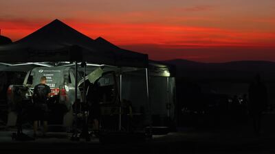 Mechanics work on a General Financing Team Pitlane Toyota Hilux. Getty Images