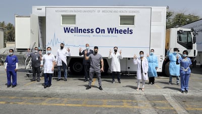 Staff members of MBRU community mobile health clinic. So far, 7,688 people received their Covid-19 vaccination through the mobile clinics in less than a month. Pawan Singh / The National