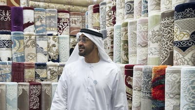 Sheikh Mohammed bin Zayed visits the carpet market in the Mina Zayed Port area. Ryan Carter for the Crown Prince Court - Abu Dhabi