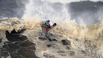 Italo Ferreira preforms on the wave during the gold medal heat.