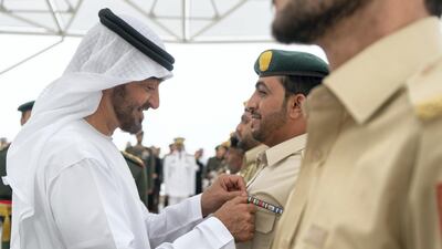 Sheikh Mohammed bin Zayed awards a member of the UAE Armed Forces with a Medal of Bravery for his service in Yemen. Rashed Al Mansoori / Crown Prince Court - Abu Dhabi. Rashed Al Mansoori / Crown Prince Court - Abu Dhabi.