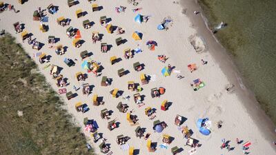 As summer temperatures soar in Germany, beach chairs are set up in rows at the Baltic sea beach in Binz. The European weather forecast is promising high temperatures for the next few days. Stefan Sauer/EPA