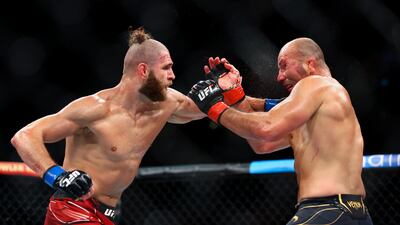 Glover Teixeira exchanges strikes with Jiri Prochazka during their light heavyweight championship fight at UFC 275. Getty