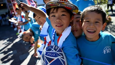 Japanese supporters wait for France's players at Kawaguchiko theatre. AFP