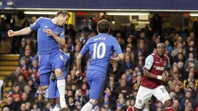 Frank Lampard, left, heads in his 200th goal for Chelsea against his former club West Ham. Sang Tan / AP Photo