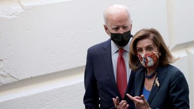 US President Joe Biden and Speaker of the House Nancy Pelosi leave a meeting with members of the House Democratic caucus on October 1, in Washington. Getty Images / AFP