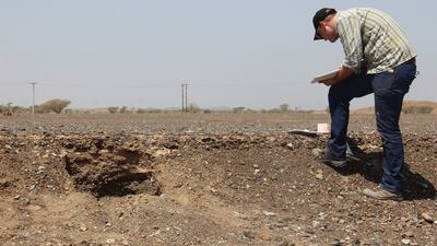 Dr Lucas Proctor collecting snail samples from the wadi in Al Khashbah in Oman. Photo: UmWeltWandel Project