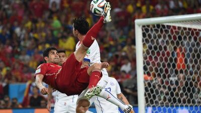 Spain forward Diego Costa attempts to play a bicycle kick against Chile on Wednesday night at the 2014 World Cup in Rio de Janeiro, Brazil. Christophe Simon / AFP