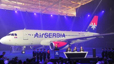 Aleksandar Vucic, Serbia’s deputy prime minister, left, Dane Kondic, chief executive officer of AirSerbia, centre, and James Hogan, president and chief executive of Etihad Aviation Group. Oliver Bunic/Bloomberg