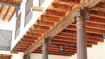 Bait Al Naboodah's distinctive carved wooden pillars. Pawan Singh / The National