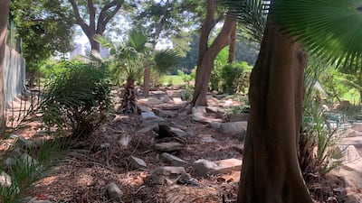 The cemetery is almost completely hidden from view by a wall and hedge that run along the side of a golf course. Hamza Hendawi / The National