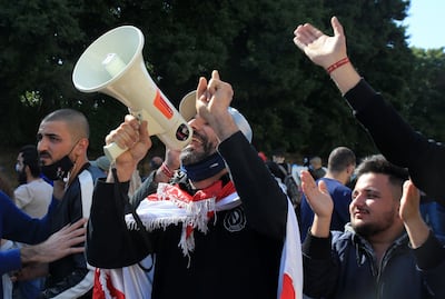 People gather to protest against the arrest of Tripoli demonstrators and the alleged repressive policies pursued by the government as 25 detainees face military trials. EPA