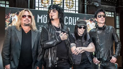 Members of the rock band Motley Crue, from left, Vince Neil, Nikki Sixx, Tommy Lee and Mick Mars pose for photographers after a press conference in London, Tuesday, June 9, 2015. The band announced their European dates for their last ever tour. Vianney Le Caer /Invision / AP