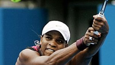 Serena Williams goes for a backhand return to Vera Dushevina during their quarter-final in Sydney.