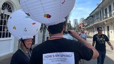 Jerome FitzGibbons of New Orleans walks the streets of the French Quarter on Mardi Gras, dressed as a Chinese spy balloon. AP