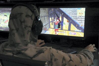 A gamer at the Booth Cafe in Khalidiya. Pawan Singh / The National