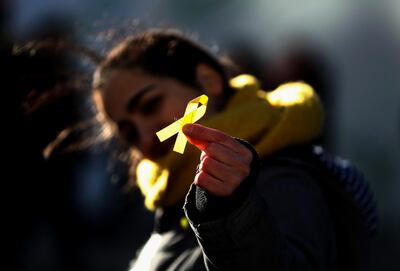 Manchester City fans wore yellow ribbons in support of Catalan independence at the League Cup final at Wembley. Catherine Ivill / Getty Images