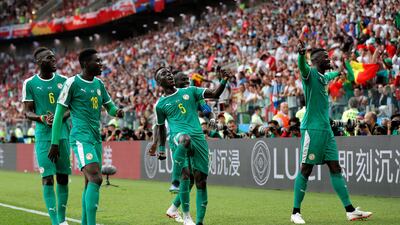 Senegal goalscorer M'Baye Niang, right, celebrates with teammates during the World Cup Group H victory over Poland. EPA
