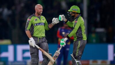 Lahore Qalandars batsmen Ben Dunk, left, and Sohail Akhtar during the Pakistan Super League match against Karachi Kings. AP Photo