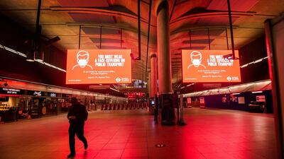A solitary person on the concourse at Canary Wharf underground station during the morning rush hour in London. AP Photo