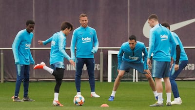 Barcelona's Sergio Busquets with team mates during training. Reuters