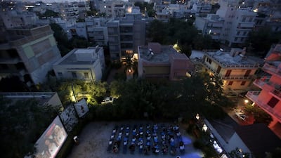 Moviegoers watch the 2014 romantic comedy Blended, starring Drew Barrymore and Adam Sandler, at the Nostalgia outdoor cinema, surrounded by apartment blocks at the northern suburb of Neo Iraklio in Athens. The municipal cinema offers discounts to the unemployed, disabled and large families. Local authorities have taken over many of the Greek capital’s outdoor movie theatres which are struggling to stay in business during the country’s severe financial crisis.