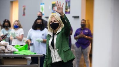 First Lady Jill Biden waves at volunteers as she arrives at the Houston Food Bank. AP Photo