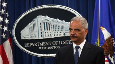 The US attorney general Eric Holder announced indictments against five Chinese military hackers on May 19, 2014, at the department of justice in Washington, DC. Alex Wong / Getty Images / AFP