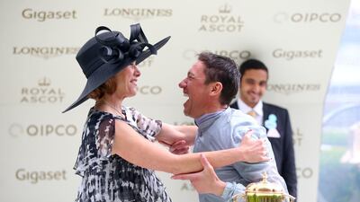 Darcey Bussell, left, presents jockey Frankie Dettori with the trophy for winning the Queen Mary Stakes with Raffle Prize. Press Association