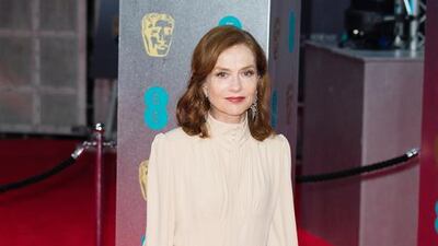 Looking every inch a lady, Isabelle Huppert wore a bespoke buttermilk-toned dress by Chloé, with a demure high-buttoned neckline. Jeff Spicer / Getty Images