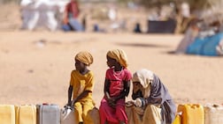 Sudanese children wait for water at the Oure Cassoni refugee camp in Chad in February. More than a quarter of Sudan's population has been displaced. Getty