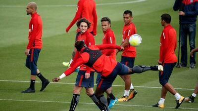 Javier Pastore, left,, Neymar, centre, and Marquinhos, right, of Paris Saint-Germain warm up during a training session. Etienne Laurent / EPA