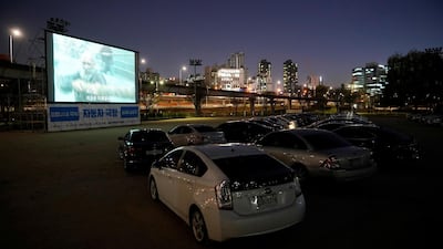 Vehicles parked at a drive-in theatre that has been temporarily made for residents to enjoy movies while keeping social distancing amid the outbreak of the coronavirus. Reuters