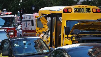 Authorities respond near a damaged school bus Tuesday, Oct. 31, 2017, in New York. A motorist drove onto a busy bicycle path near the World Trade Center memorial and struck several people on Tuesday police and witnesses said. (AP Photo/Mark Lennihan)