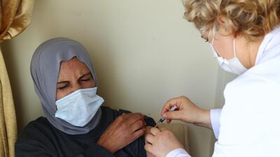 Ameera Darweesh, a 63-year old Jordanian woman living in Turkey, receives the first dose of Sinovac's CoronaVac coronavirus disease vaccine at a healthcare centre in the Mediterranean town of Alanya, Turkey. Reuters