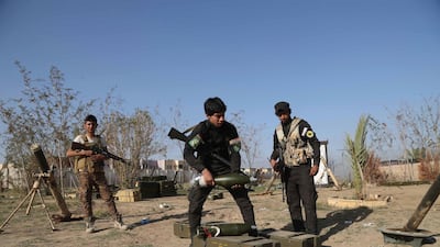 Young Shiite volunteer militia members prepare to attack ISIS fighters in Tikrit, north of Baghdad. AP, File